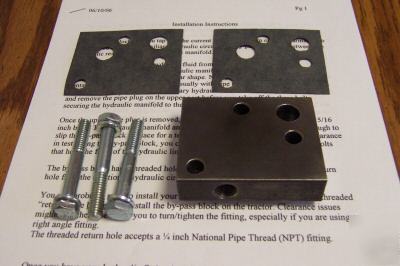Hydraulic by-pass block for a farmall cub